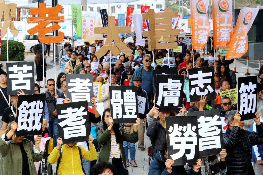 Concerned citizens march to the office of the Hong Kong chief executive in Admiralty to protest against the raising of the age threshold for elderly welfare payments, on January 27. Photo: Edmond So