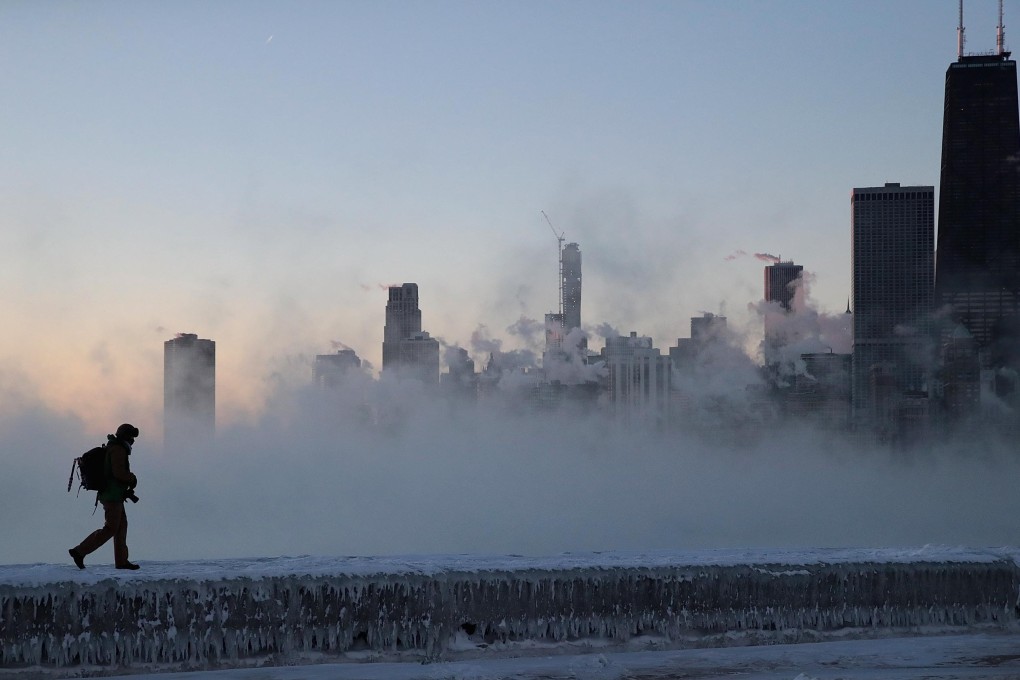 A man walking along Lake Michigan in Chicago on Thursday. Photo: AFP