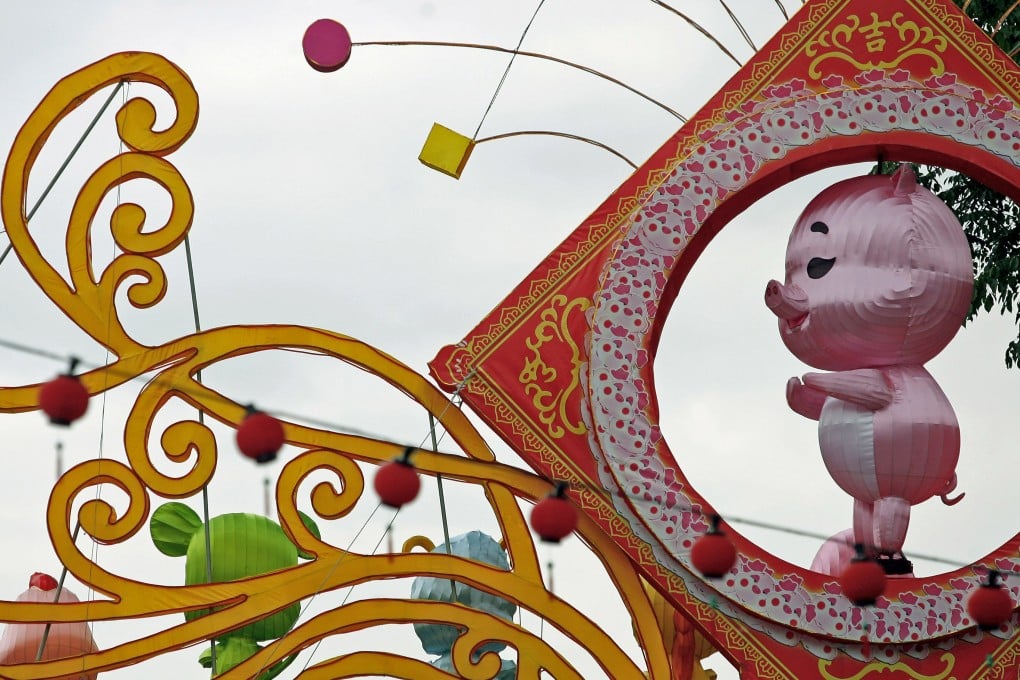 A lantern shaped as a pig at a temple in Kuala Lumpur celebrates the Chinese New Year. Photo: AFP