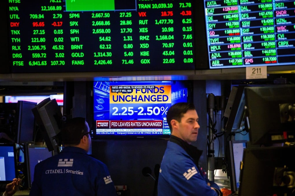 Traders work on the floor of the New York Stock Exchange on January 30. The ongoing revelations of companies’ fourth-quarter earnings can be expected to affect stocks and help investors and analysts prepare for the year ahead. Photo: Bloomberg