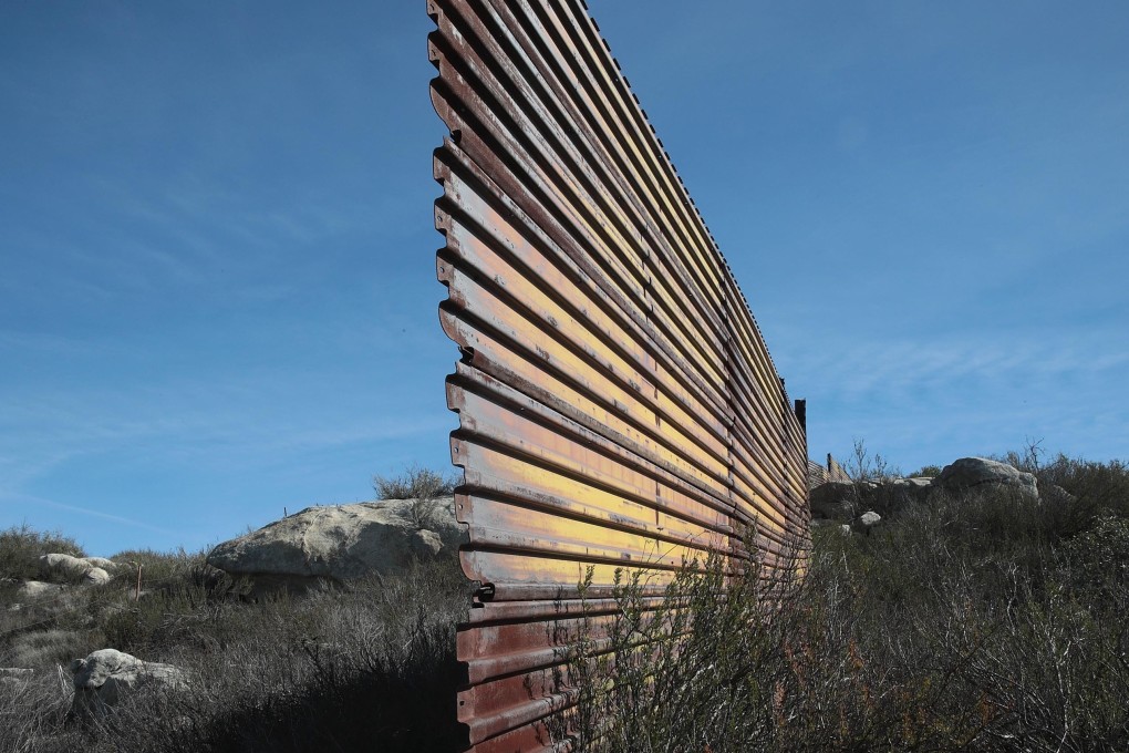 An older section of border wall that separates the United States and Mexico ends at a ravine on January 27, 2019 near Campo, California. Photo: AFP