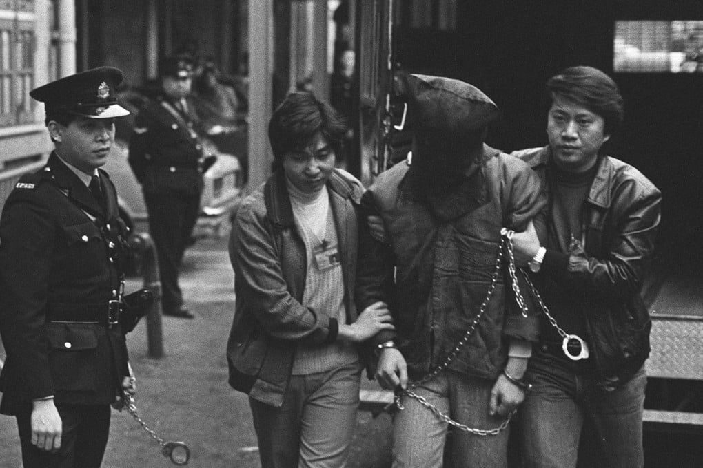 A suspect accused of robbing the Po Sang Bank, in Central, outside Western Court in February 1984.