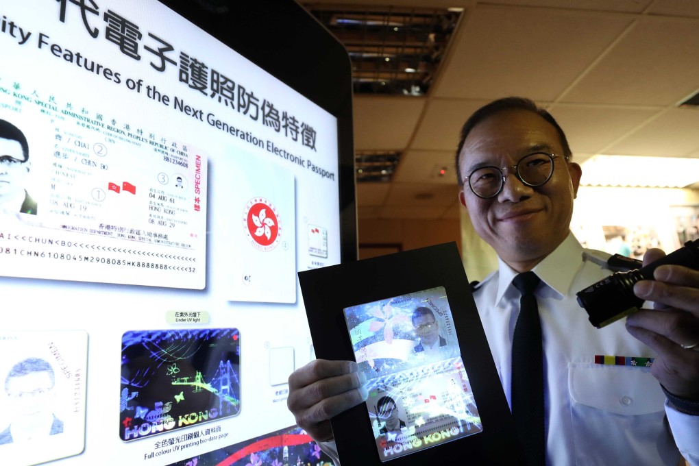 Director of Immigration Erick Tsang presenting the new passport designs. Photo: Winson Wong