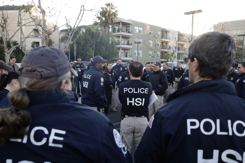 In this 2015 file photo, federal agents gather before raiding an upscale flat complex where authorities say a birth tourism business charged pregnant women US$50,000 for lodging, food and transport, in Irvine, California. On Thursday, authorities announced they have charged 20 people in a crackdown on businesses that helped hundreds of Chinese women travel to the United States to give birth to American citizen children. Photo: AP