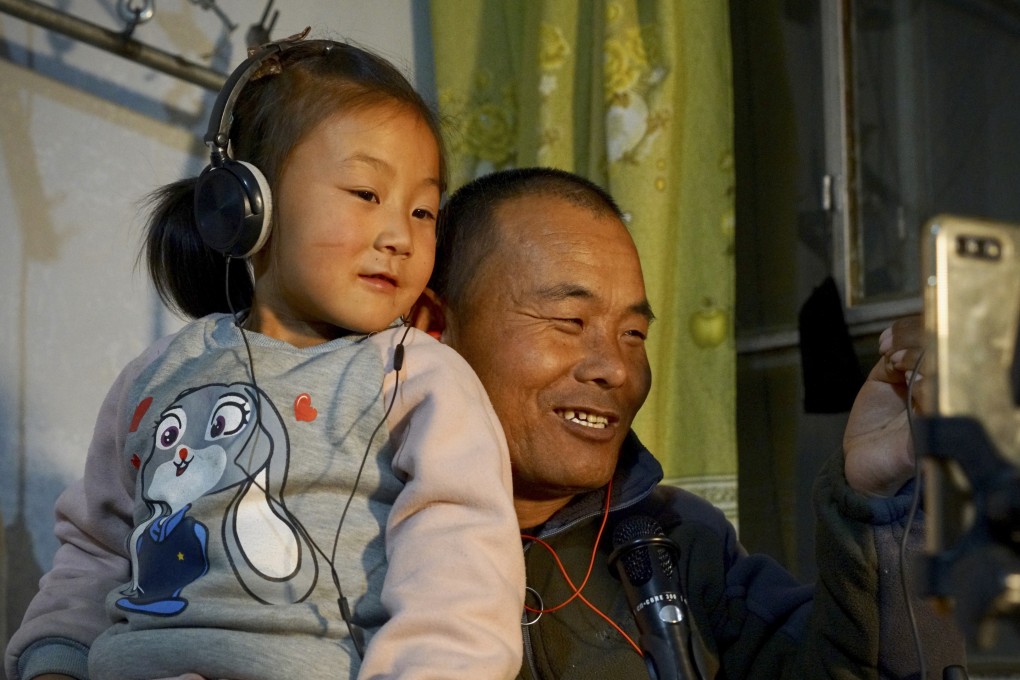 Tian Haicheng (right) and his daughter Jiajia have won legions of fans live-streaming from their home in rural Ningxia. Photo: Tom Wang