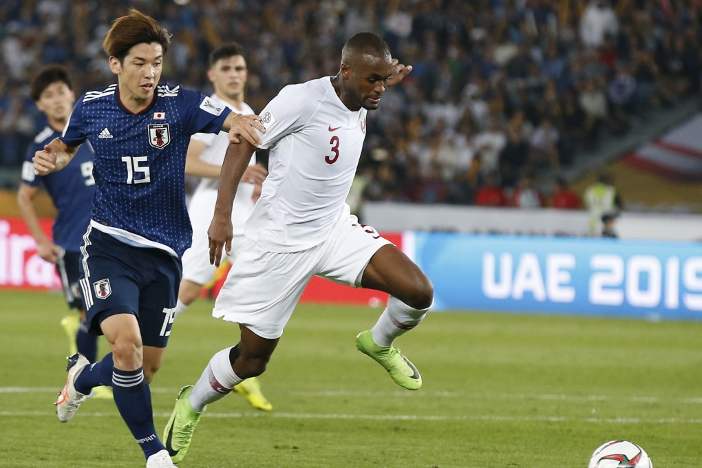 Japan's Yuya Osako (L) vies with Qatar's Abdelkarim Hassan during the final. Photo: Xinhua