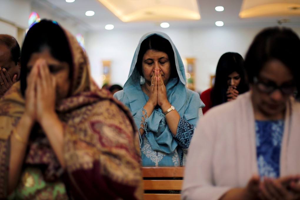 Worshippers pray during mass at St Francis of Assisi Catholic Church in Jebel Ali, Dubai. Photo: Reuters