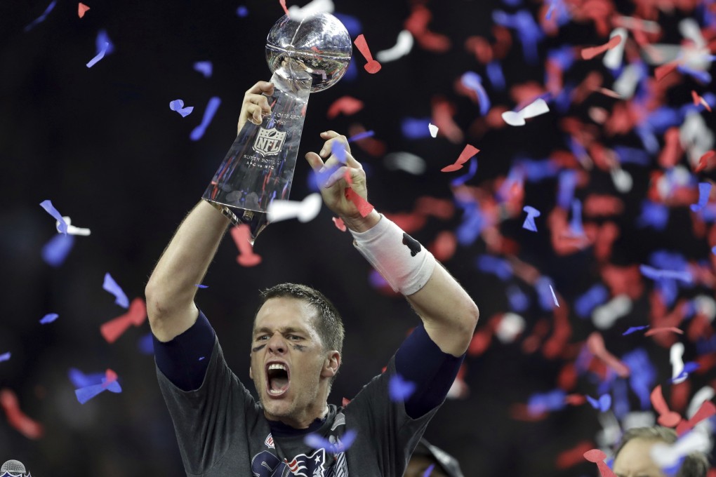 The New England Patriots’ Tom Brady raises the Vince Lombardi Trophy after defeating the Atlanta Falcons in overtime in Super Bowl 51. Photo: AP