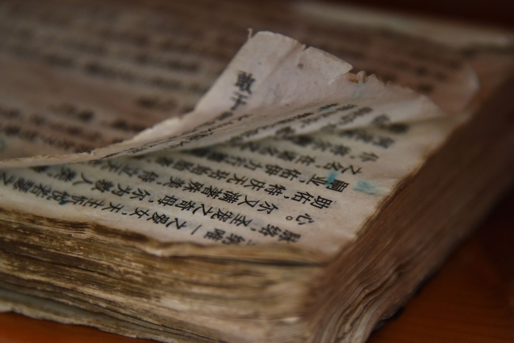 A worn bible is seen at a new government-sanctioned Catholic church in Xincun, Henan. China’s estimated 10 million Catholics are legally supposed to attend only churches governed by a state-controlled body with clergy appointed by the party. Photo: AFP