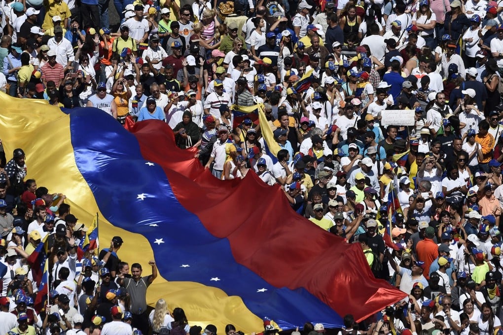 Opposition activists pour to the streets to back Venezuelan opposition leader Juan Guaido's calls for early elections, in Caracas. Photo: AFP