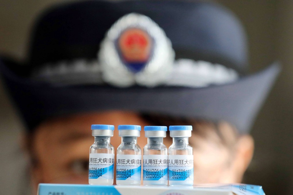 A law enforcement officer checking vaccines in Rongan, China, in July. China’s corruption watchdog on Saturday said it had disciplined more than 80 officials linked to a vaccine scandal last year. Phto: EPA-EFE