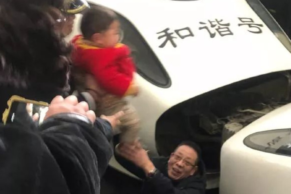 A three-year-old boy escaped unharmed after falling onto the track at a railway station in central China. Photo: Thepaper.cn