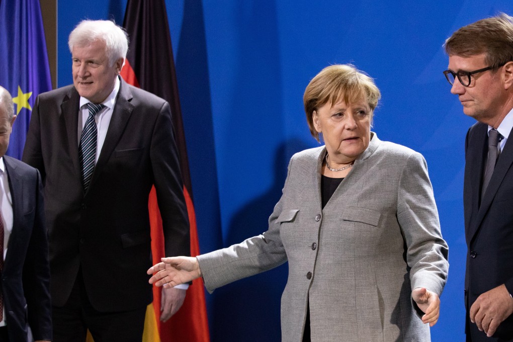 (Left to right) Minister of Finance Olaf Scholz, Minister of Interior, Construction and Homeland Horst Seehofer, German Chancellor Angela Merkel and Chairperson of the Coal Commission Ronald Pofalla. Photo: EPA-EFE