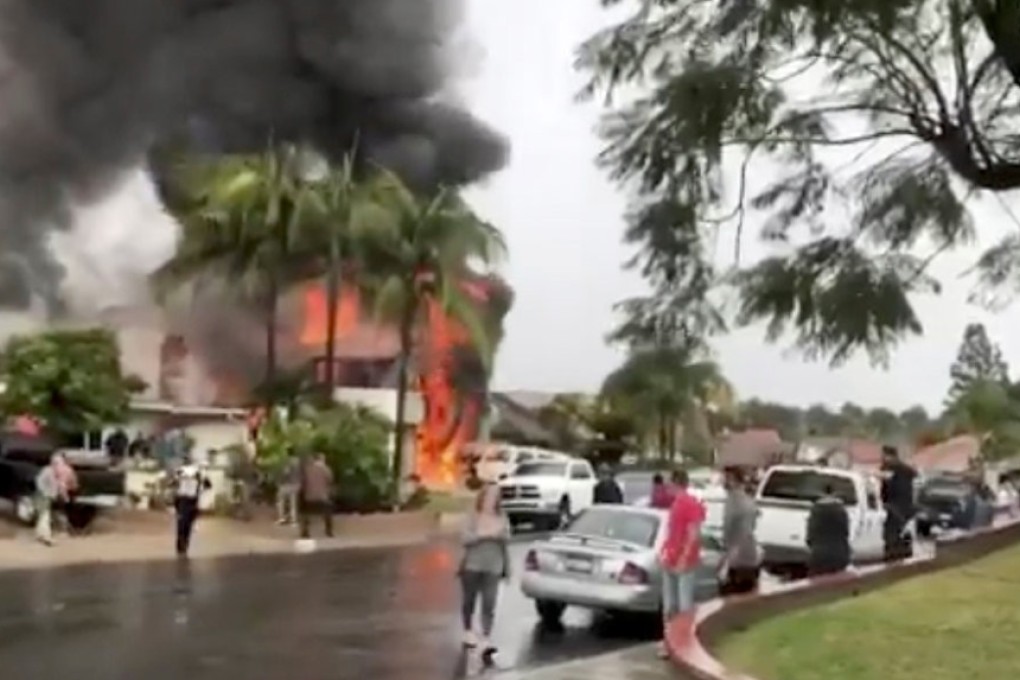 Smoke billows from the house in Yorba Linda after a plane crashed into it. Photo: Reuters