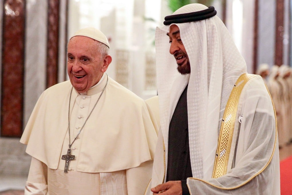 Pope Francis (L) is welcomed by Abu Dhabi's Crown Prince Sheikh Mohammed bin Zayed al-Nahyan upon his arrival at Abu Dhabi International Airport in the UAE capital on February 3. Photo: AFP