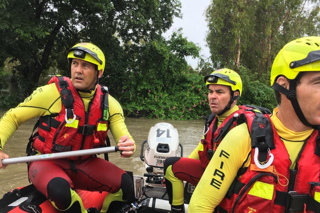 Queensland Fire and Emergency Services shows rescue crews responding to flood conditions in Townsville. Photo: EPA