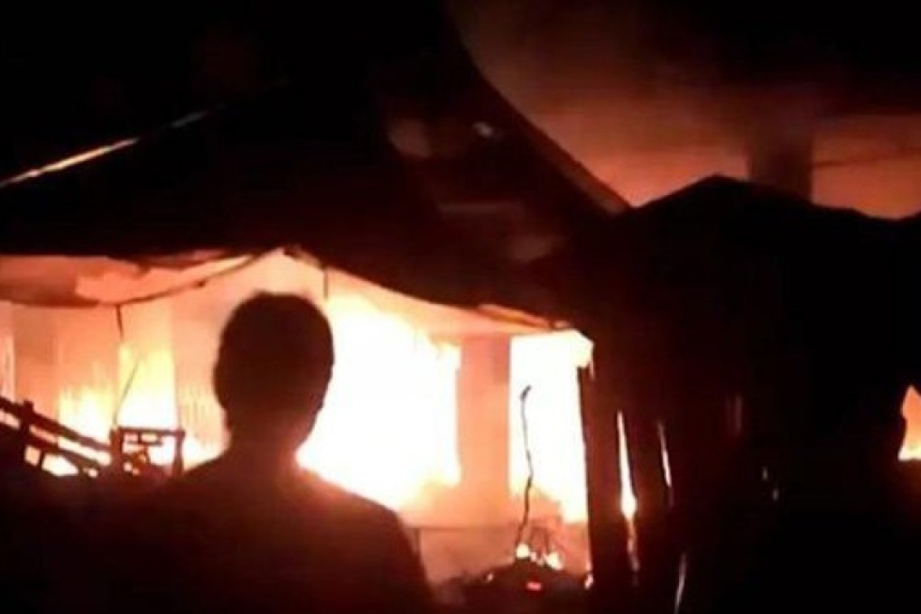 A shop caught fire after someone set off a firecracker outside. Photo: Weibo