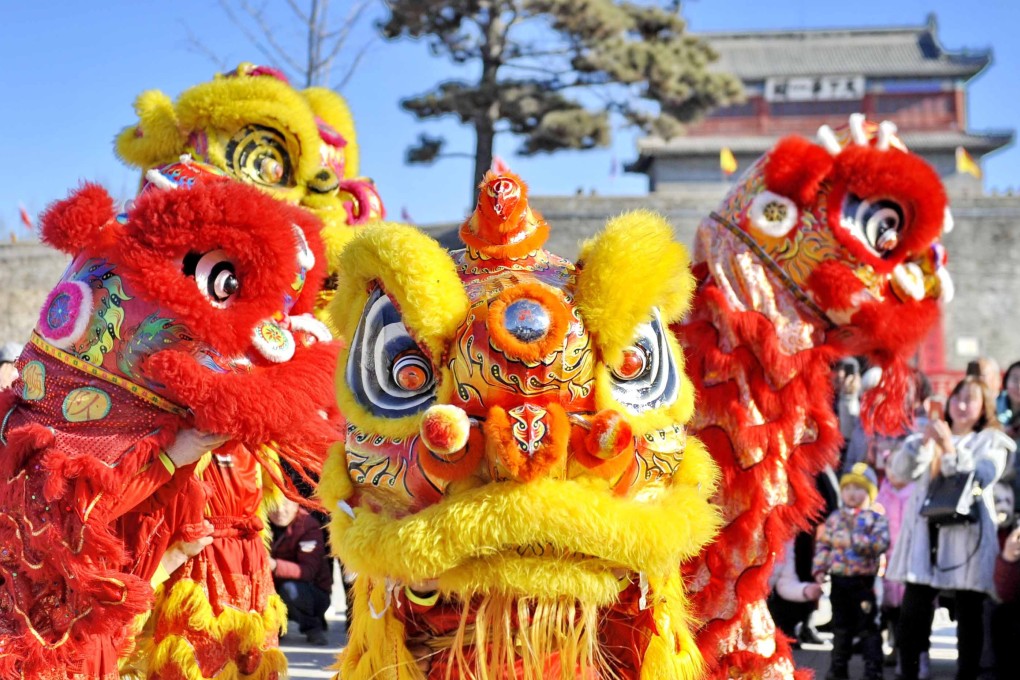 A lion dance is performed at Shanhaiguan Pass, a tourist resort in Qinhuangdao City in north China's Hebei province. Photo: Xinhua