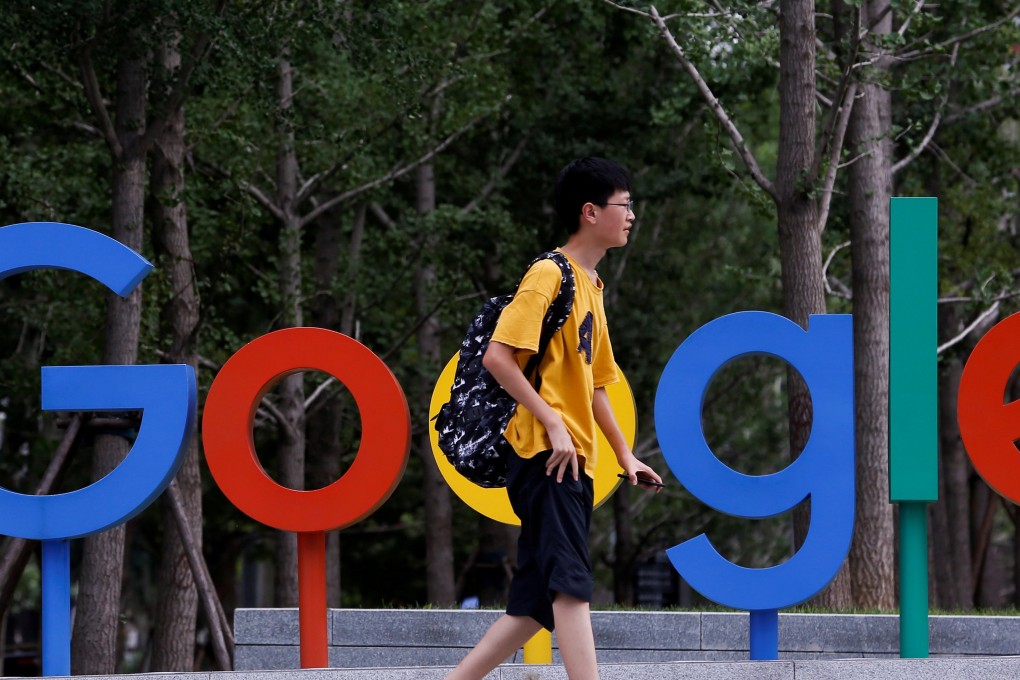 A man walks past the brand logo of Alphabet Inc's Google outside its office in Beijing, China, August 8, 2018. Photo: Reuters