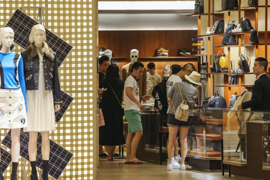 Chinese tourists at a luxury goods store in Hong Kong. While it is too early for local designers to be considered as rivals to established global fashion houses, there are more opportunities for Chinese brands in the current market, says designer Wilson Li. Photo: Dickson Lee