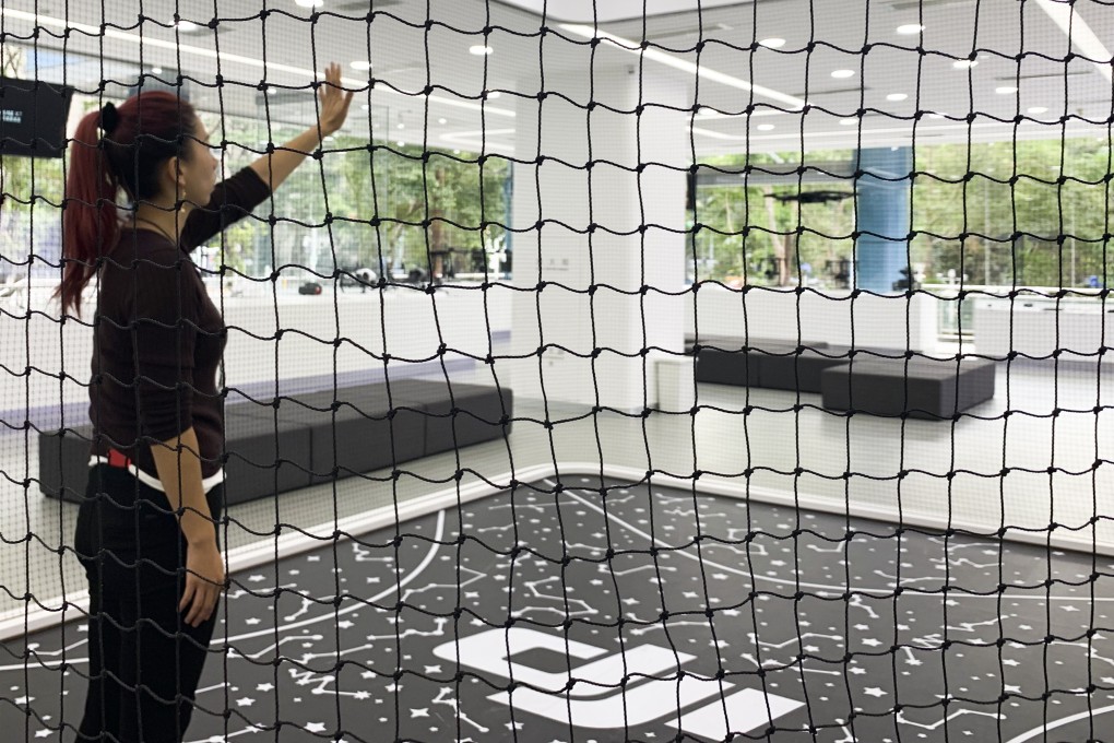 A small drone hovers inside the exhibition hall of DJI in Shenzhen, China. Photo: Celia Chen