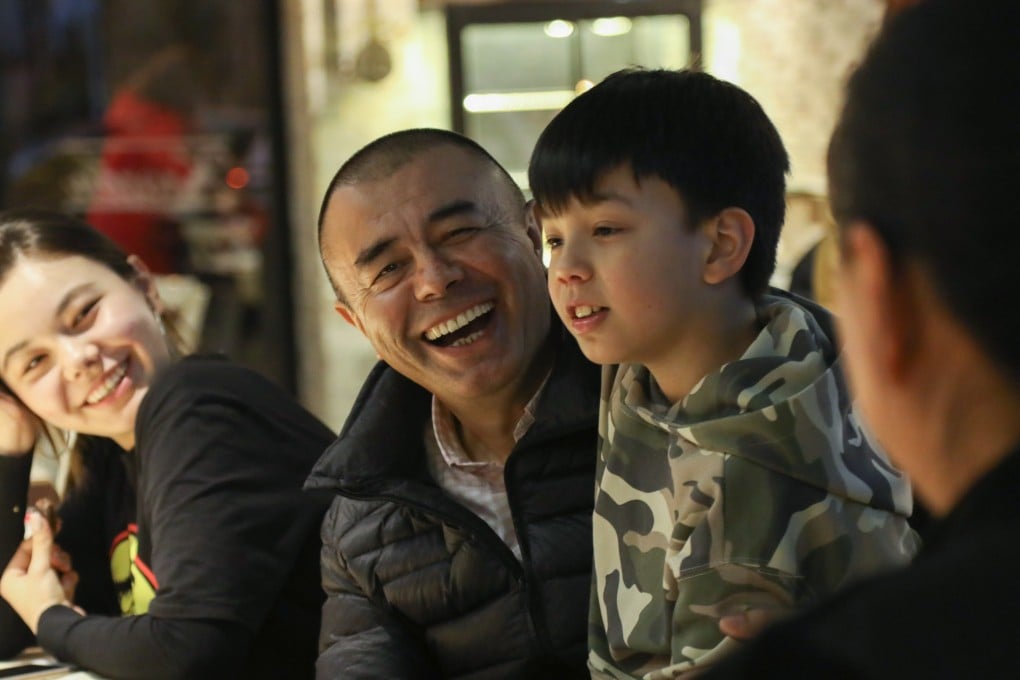 Kerem Mamut with his son, Babur, wife Wang Yi and daughter Yadigar in Istanbul. Photo: Helene Franchineau