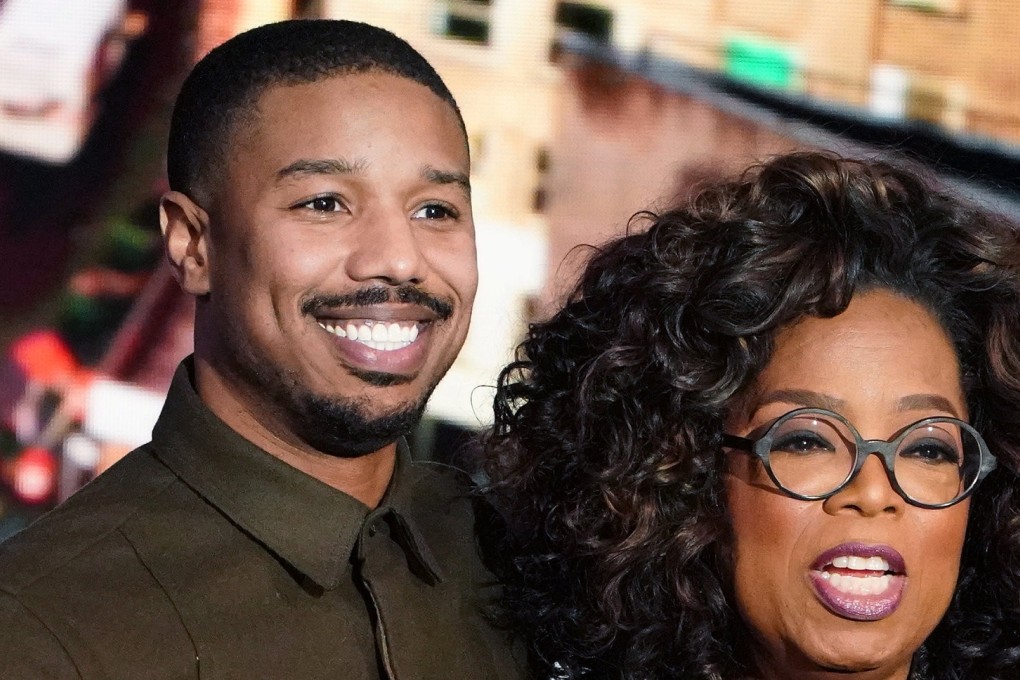 Actor Michael B. Jordan hugs Oprah Winfrey on stage during the taping of her TV show in which he discussed going into therapy after filming Black Panther. Photo: Reuters