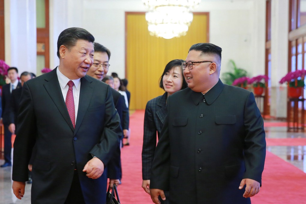 Chinese President Xi Jinping and North Korean leader Kim Jong-un chat during a meeting in Beijing in June 2018. Photo: EPA-EFE