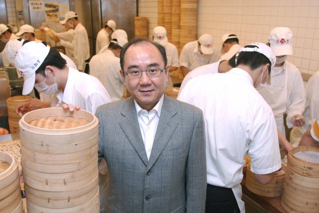 Yang Chi-hua, owner of Taiwan’s Din Tai Fung restaurant chain, stands next to piles of bamboo steamers in December 2007, in Taipei. Photo: AFP