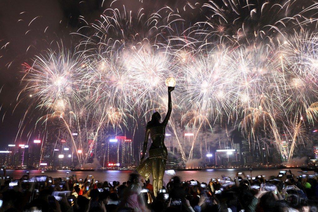 Fireworks light up Victoria Harbour to celebrate Lunar New Year, photographed from the Avenue of Stars. Photo: Nora Tam
