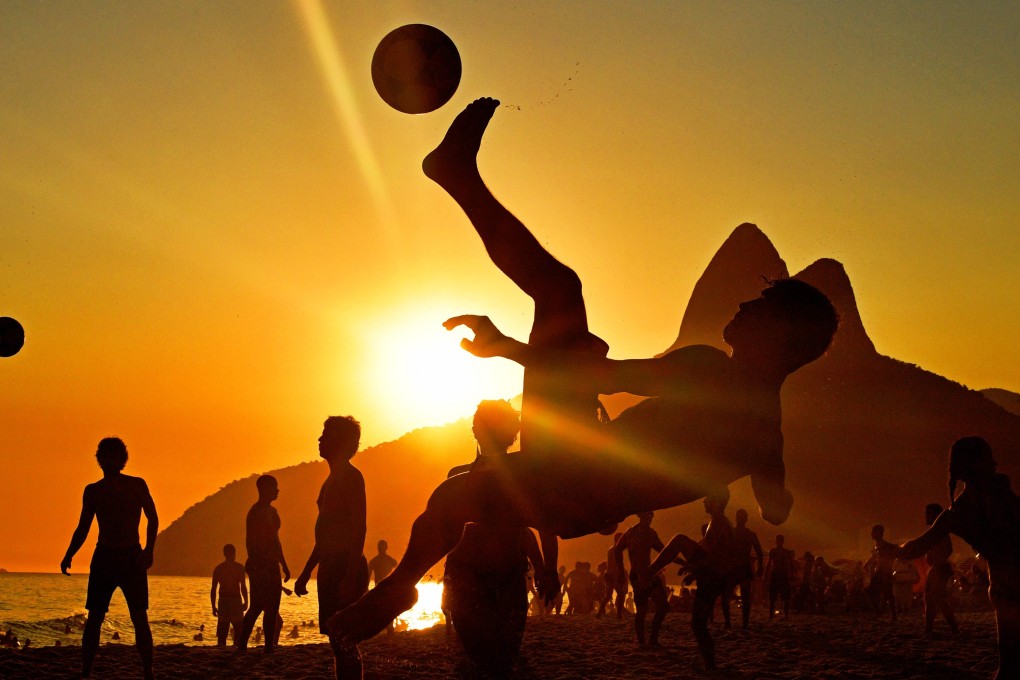 Beachgoers play football at sunset on Ipanema Beach in Rio de Janeiro, Brazil on Friday. Last month was the hottest January ever recorded in Brazil. Photo: AFP