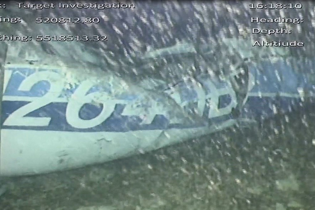 A handout video footage still image released by the UK Air Accidents Investigation Branch (AAIB) shows the rear left side of the fuselage, including part of the aircraft registration, identified as part of the wreckage from the missing Piper Malibu aircraft that disappeared two weeks ago carrying footballer Emiliano Sala and pilot David Ibbotson lying on the seabed under the English Channel. Photo: AFP/AAIB