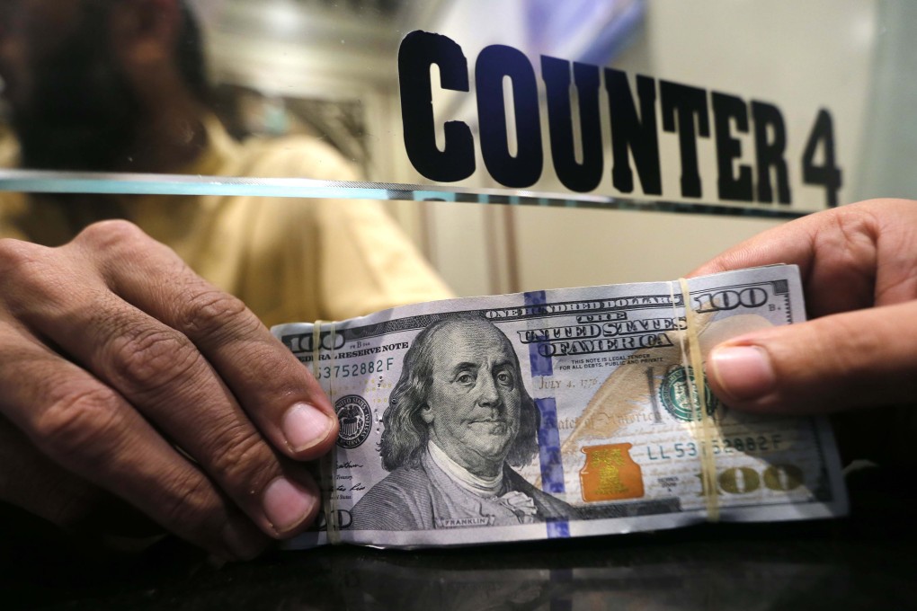 A currency exchange dealer in Peshawar, Pakistan on October 19, 2018. Financial analysts have turned more bullish on emerging markets since the Fed announced a consequential shift in monetary policy on January 30, 2019. Photo: EPA
