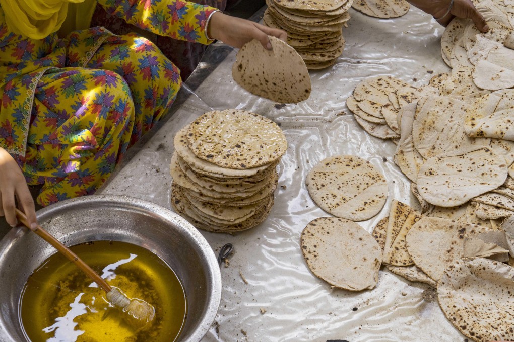 Ghee is added to chapattis at the Golden Temple in Amritsar, India. Photo: Alamy