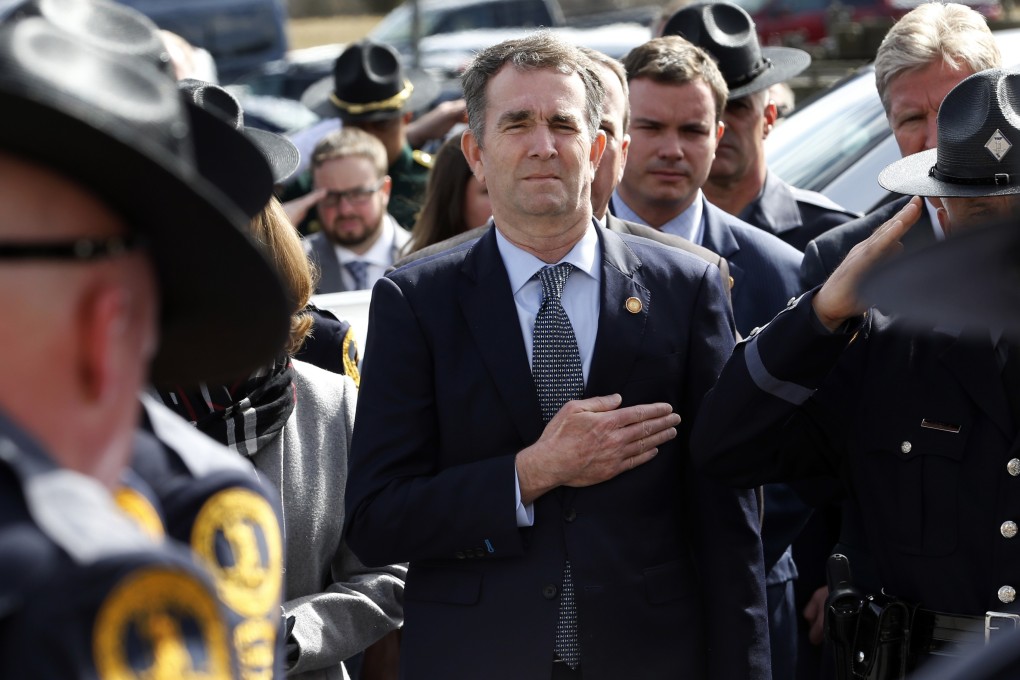 Ralph Northam, left, and his wife Pam, watch as the casket of fallen Virginia State Trooper Lucas B. Dowell is carried to a waiting tactical vehicle during the funeral at the Chilhowie Christian Church in Chilhowie. Photo: AP Photo
