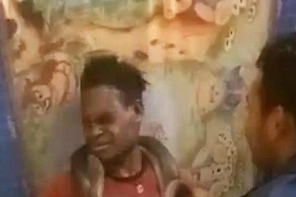 Screengrab of a video showing the interrogation of a suspect using a snake. Photo: Twitter