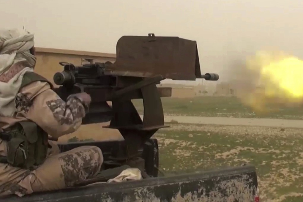 This image purports to show a gun-mounted IS vehicle firing US-backed Syrian Democratic Forces. Photo: AP