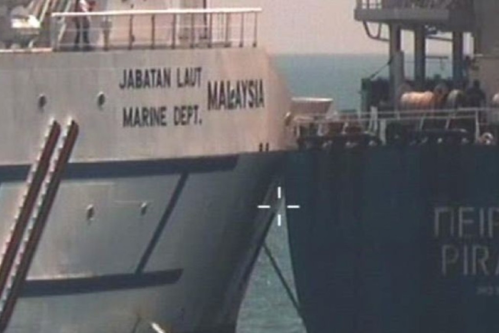 The collision between Polaris, which had been parked in waters that Singapore claims to be part of its port limit, and the Greece-registered bulk carrier Piraeus, happened on Saturday Photo: The Straits Time/ Singapore Police Force