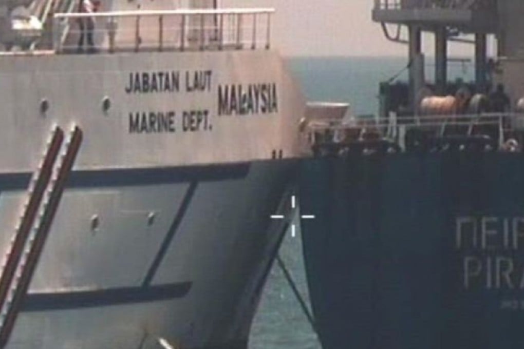 The collision between Polaris, which had been parked in waters that Singapore claims to be part of its port limit, and the Greece-registered bulk carrier Piraeus, happened on Saturday Photo: The Straits Time/ Singapore Police Force