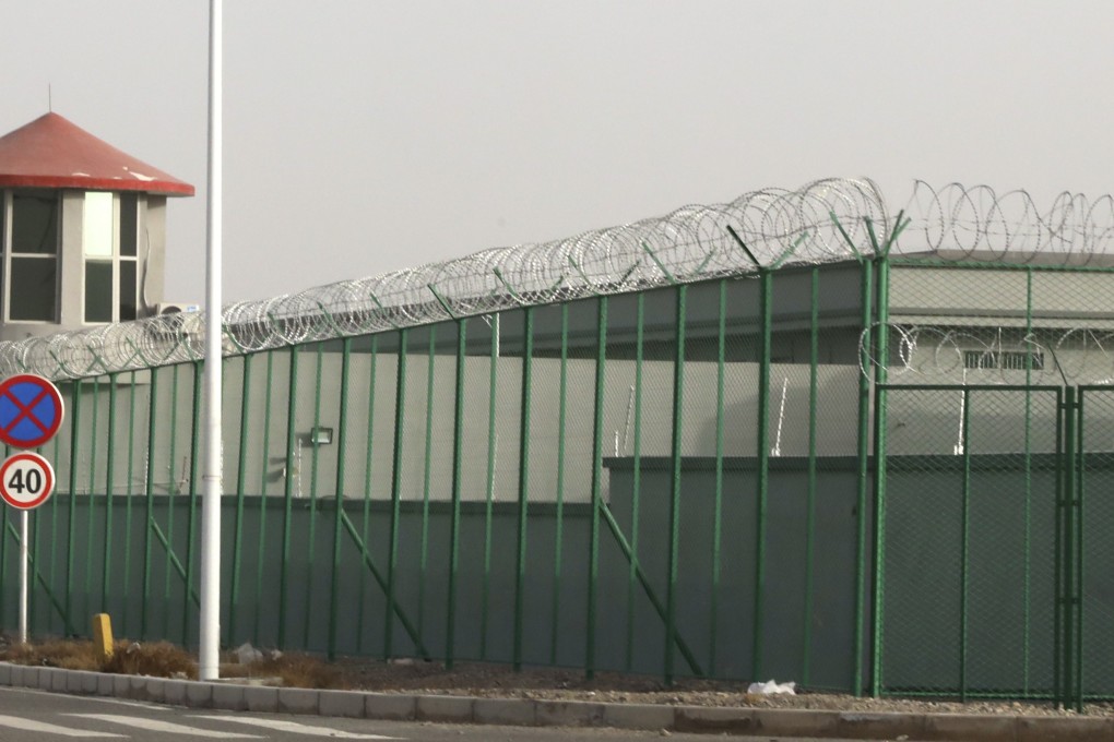 A guard tower and barbed wire fence around a facility in the Kunshan Industrial Park in Artux in western China’s Xinjiang region. This is one of a growing number of internment camps in the region. File photo: AP