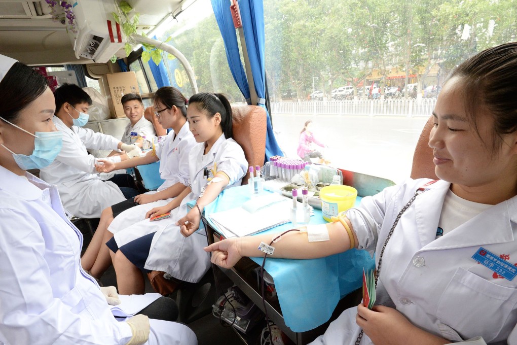 Hospital staff members donate blood to mark World Blood Donor Day, in June 2017 in China’s northern Hebei province. Photo: AFP