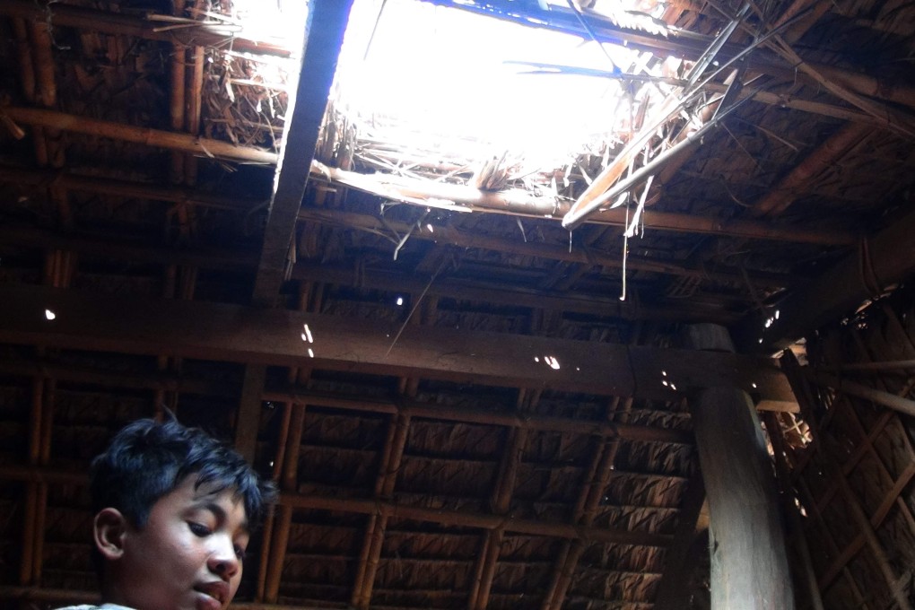 This man’s house was damaged by explosions and gunfire. Photo: AFP