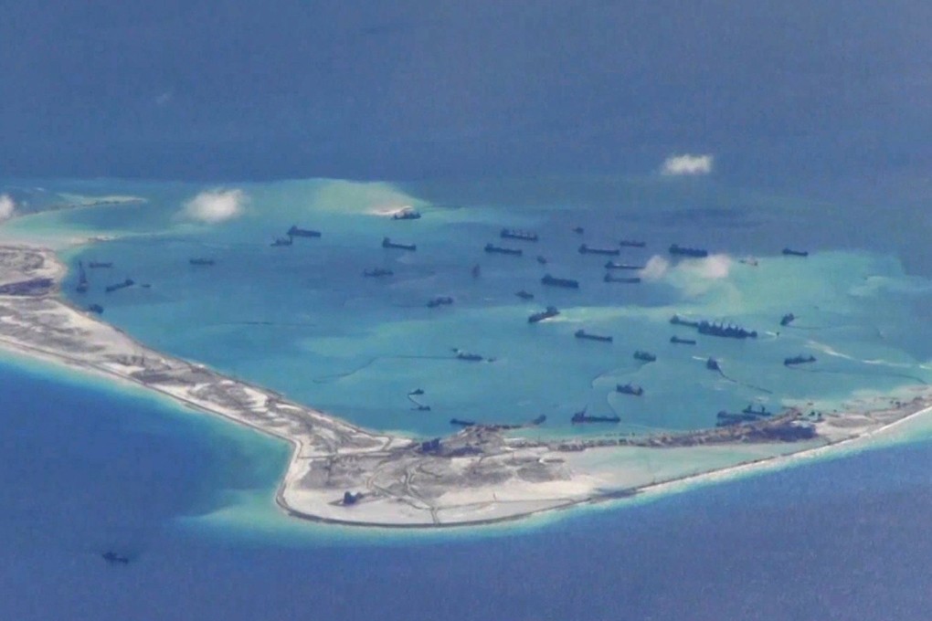 A fleet of Chinese dredgers at work in the waters around Mischief Reef in the Spratlys in the South China Sea, the disputed islands group which was the focus of a US “freedom of navigation” exercise by two destroyers on Monday. Photo: Reuters