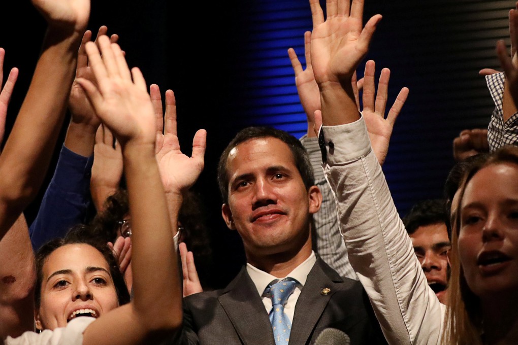 Venezuelan opposition leader Juan Guaido, who many nations have recognized as the country's rightful interim ruler, is seen with students in Caracas, Venezuela February 11, 2019. REUTERS/Andres Martinez Casares TPX IMAGES OF THE DAY