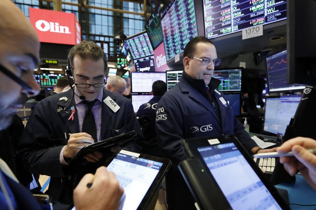 Traders work on the floor of the New York Stock Exchange on Tuesday. Photo: AP