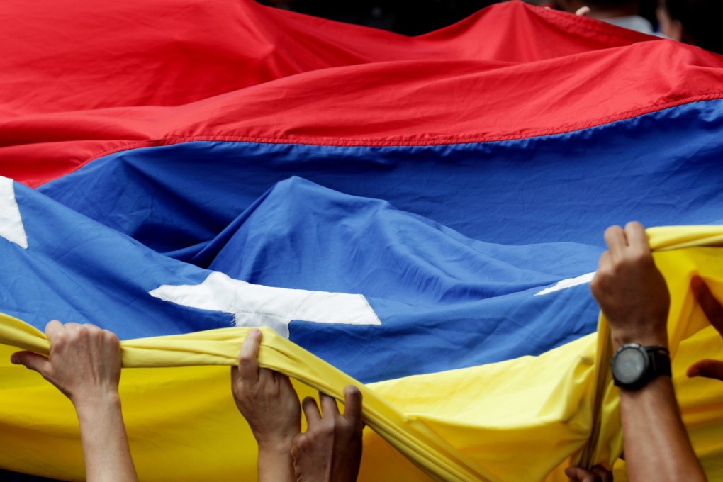 China has dismissed a report of talks between its diplomats and representatives of Venezuela’s political opposition as “fake news”. Photo: EPA