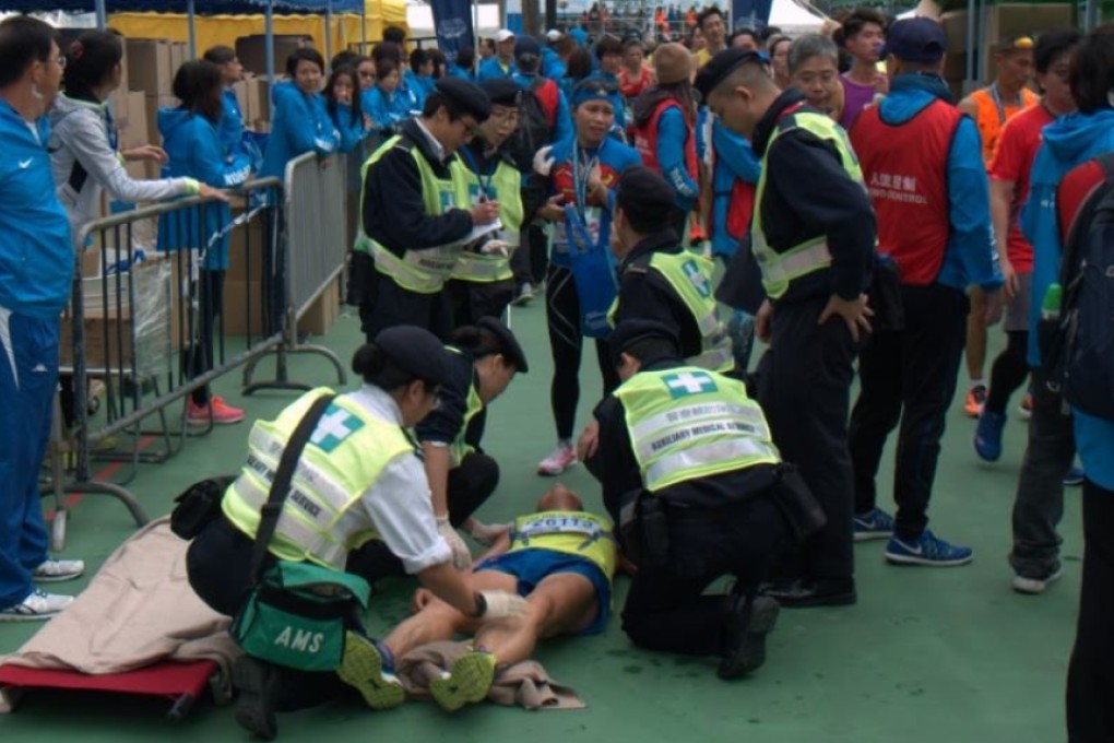 Paramedics attend to a runner who collapsed at the finish line of last year’s Standard Chartered Hong Kong Marathon. Photo: Mark Agnew