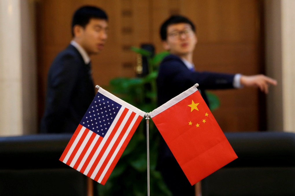 Chinese and US flags are set up for a signing ceremony during a visit by US Secretary of Transportation Elaine Chao at China’s Ministry of Transport in Beijing in April 2018. China announced that it would scrap foreign ownership limits on local auto firms, paving the way for foreign companies that want to open wholly-owned subsidiaries in the country. Photo: Reuters