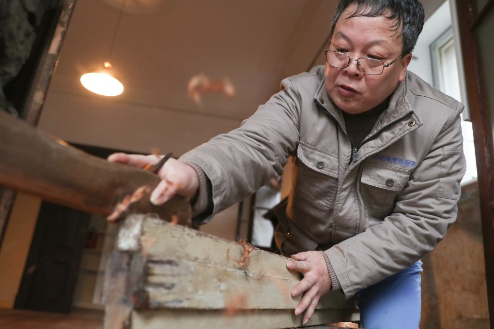 Ma Jiale works in an old building in Shanghai. He has spent much of his working life repairing some of the city’s most attractive historical buildings. Photo: AFP