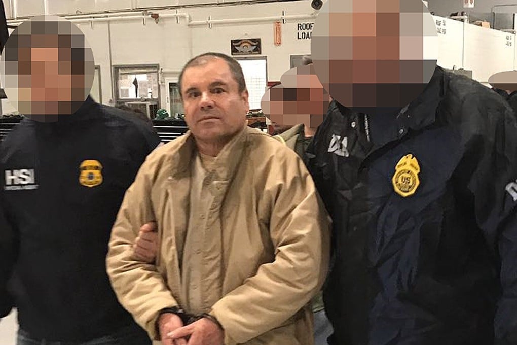 In this file photo released by the Mexican Interior Ministry, Joaquin “El Chapo” Guzman is escorted in Ciudad Juarez by the Mexican police as he is extradited to the United States. Photo: AFP